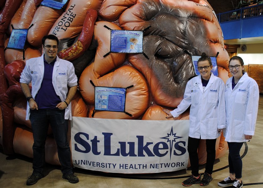 Da Vinci Science Center staff poses with the MEGA Brain.