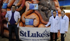 Da Vinci Science Center staff poses with the MEGA Brain.