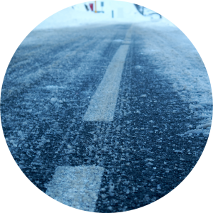 Wintery photo of road salt on a two-lane road